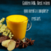 Glass of golden milk surrounded by turmeric, ginger, and spices on a blue background.
