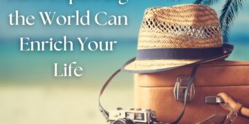 Travel essentials including a suitcase, straw hat, and vintage camera with a beach background.