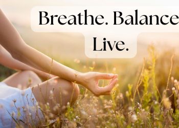 Woman practicing breathing techniques outdoors for calm and balance.