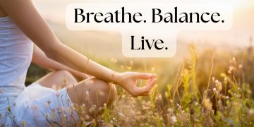 Woman practicing breathing techniques outdoors for calm and balance.