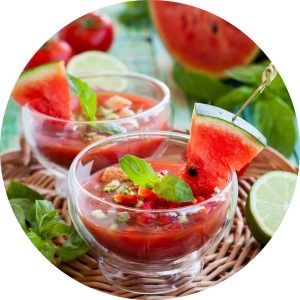 Cold summer soup with watermelon, tomato, and fresh basil.